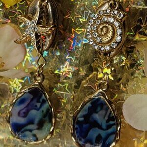 Golden shells and blue marble